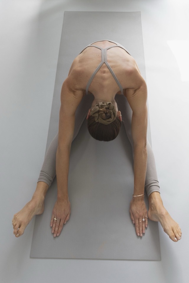 Forward fold on the mat